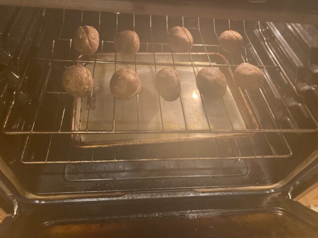 Baked potatoes baking